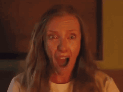 Close Up Woman's Face Yellow Background GIF