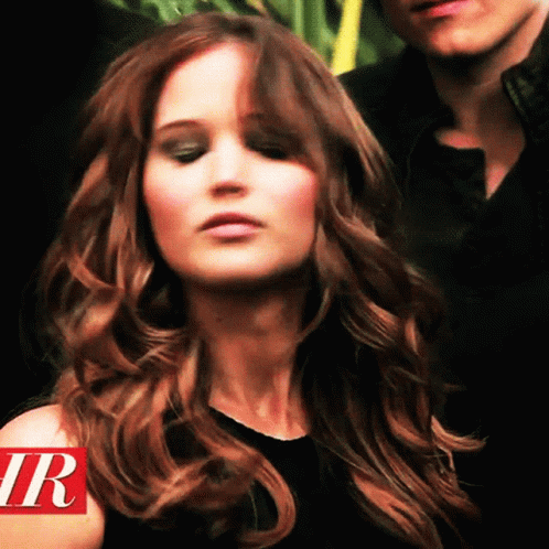 Close Up Woman With Letter R On Shoulder GIF