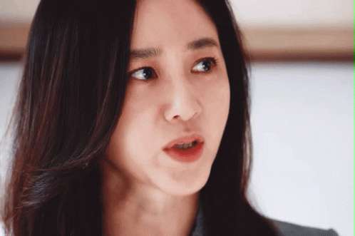 Close-Up Woman With Serious Look GIF