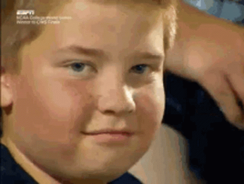 Close Up Young Boy Face With ESPN Logo GIF