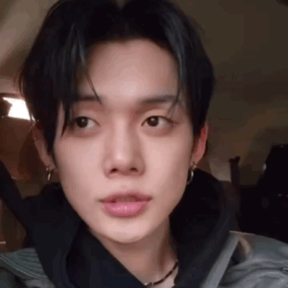 Close Up Young Man in Black Jacket With Earrings