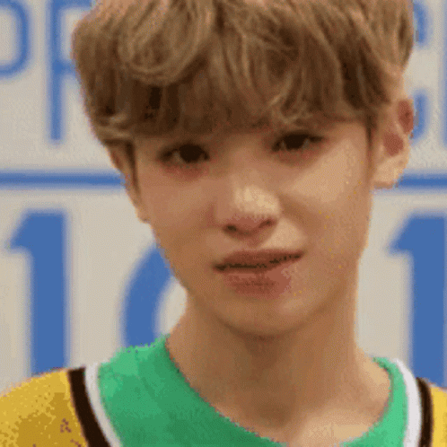 Close Up Young Man in Yellow and Green Shirt