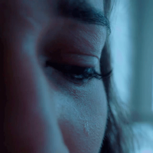 Closeup Of Woman's Eye With Tear GIF