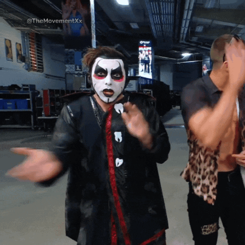 Clown Face Man Standing Next to Another