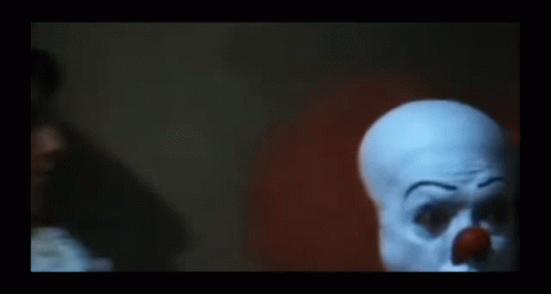 Clown Holding Hand to Face