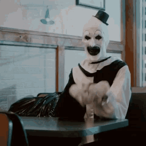 Clown in Top Hat at Diner