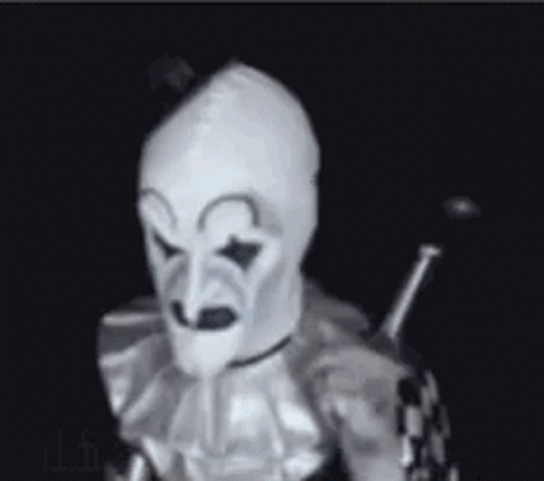 Clown in White Mask Holding Sword