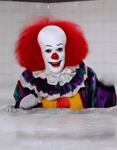 Clown Smiling in Bathtub Red Hair Red Nose
