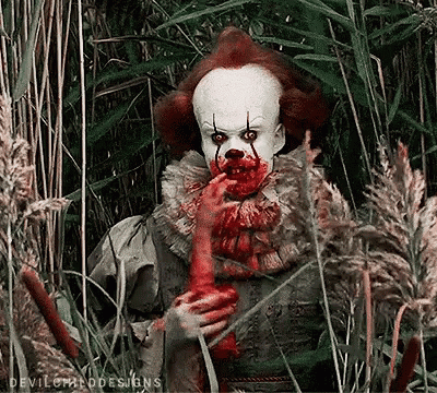 Clown With Blood on Face Eating Chicken