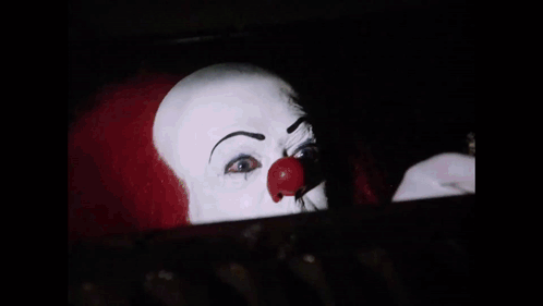Clown with Red Nose and White Face Paint