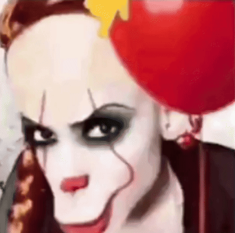 Clown Woman Holding Red Balloon