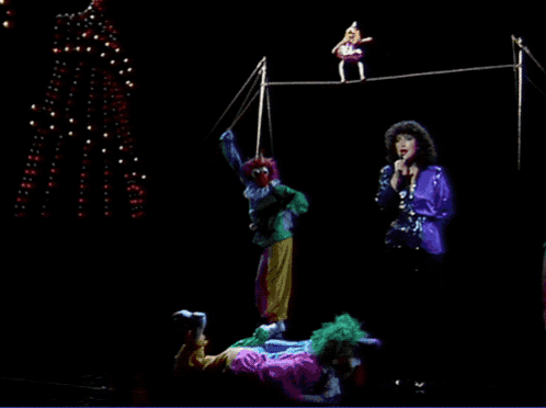 Clowns Performing on Stage with Singing Woman