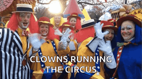 Clowns Posing With Caption Clowns Running the Circus
