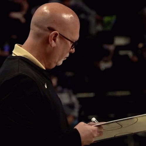 Coach of the Year Ad Bald Man Holding Basketball