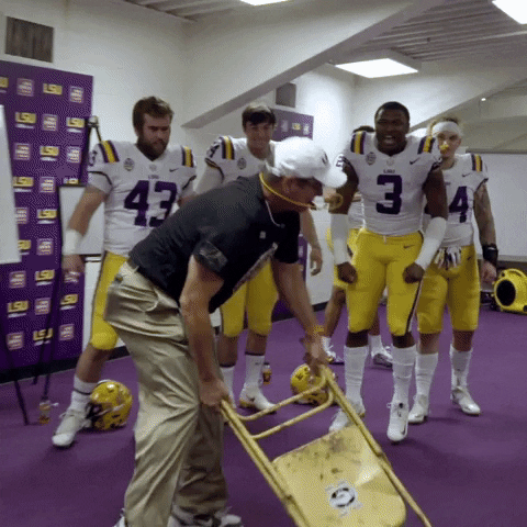 Coaching Staff Of Ed Orgeron Smashing Steel Chair GIF