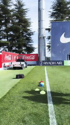 Coca Cola Truck Parked In Front Of Nike Sign GIF