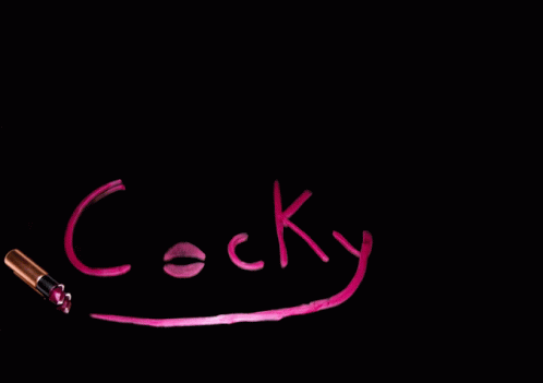 Cocky Written in Pink on Black Surface