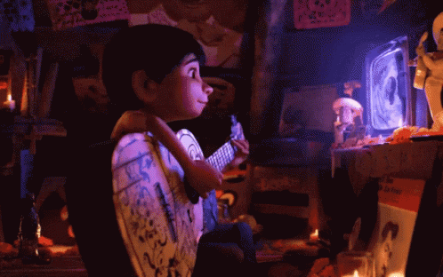 Coco Miguel Playing Guitar While Watching Tv GIF