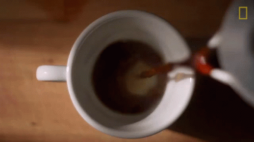 Coffee Being Poured Into Cup