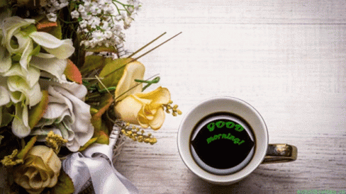 Coffee Cup Beside Flowers Saying Good Morning