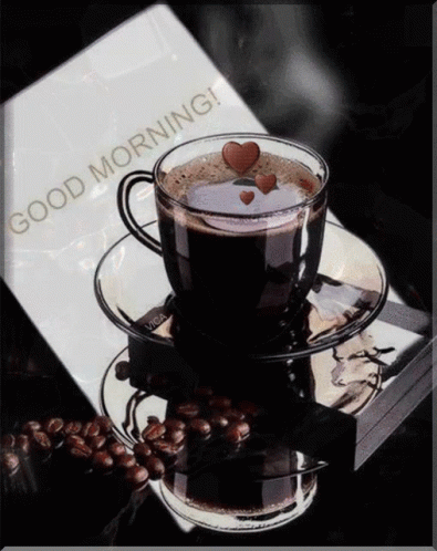 Coffee Cup on Saucer Next to Good Morning Book
