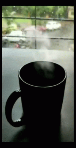 Coffee Cup on Table in Front of Window