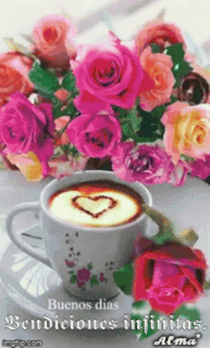 Coffee Cup With Heart Next to Pink Roses