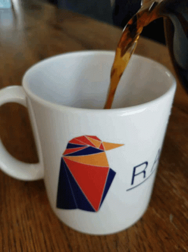 Coffee Poured Into White Mug With Bird and Letter R