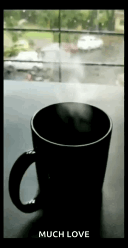 Coffee With Steam Next to Window