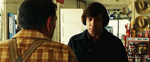 Serious Javier Bardem Coin Flip GIF