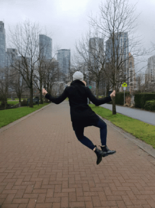 Cold Woman Jumping For Joy GIF