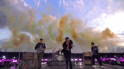 Coldplay At Brit Awards With Smoke Above Them GIF