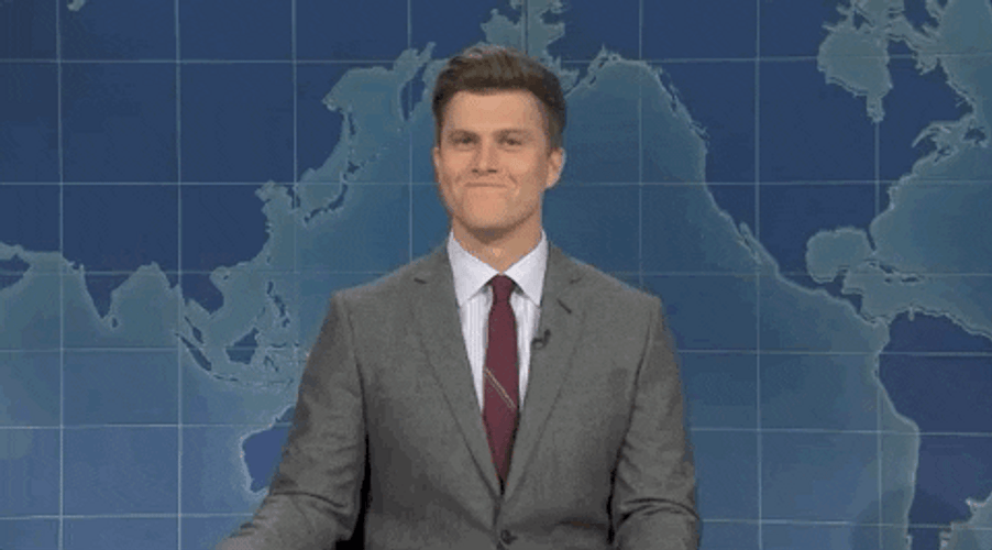 Colin Jost Trying Not To Laugh GIF