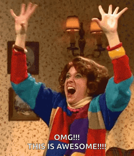Colorful Sweater Woman Raising Arms Omg This Is Awesome GIF