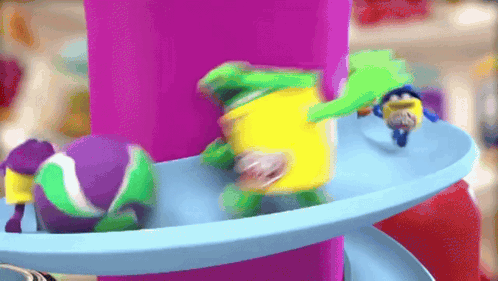 Colorful Toys On Blue And Purple Carousel GIF