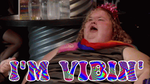 Colorful Woman Saying I'm Vibin GIF