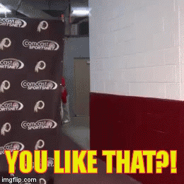 Comcast Sportsnet Sign Behind A Wall GIF