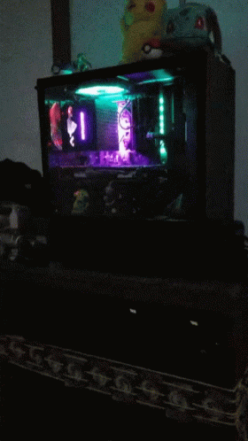 Computer With Purple Light Behind It