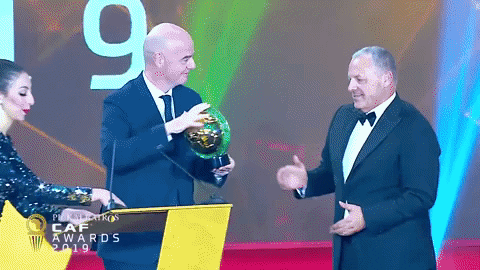 Confederation Of African Football Awarding Smile And Wave GIF