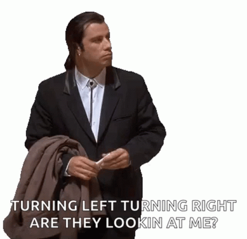 Confused Actor John Travolta Turning Left And Right GIF