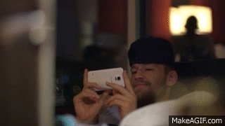 Conor Mcgregor Looking At Phone GIF