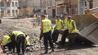Construction Workers Tossing Rocks GIF