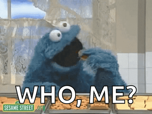 Cookie Monster From Sesame Street Eating A Cookie And Asking Who Me GIF