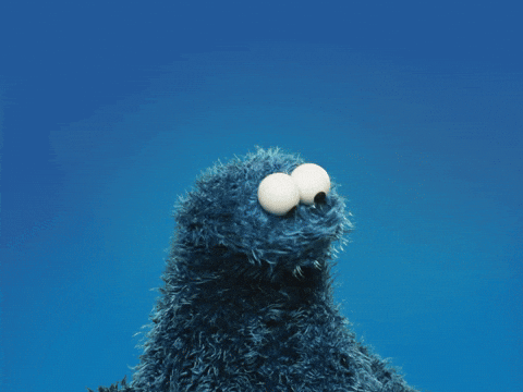 Cookie Monster In The House Eating Two Cookies GIF