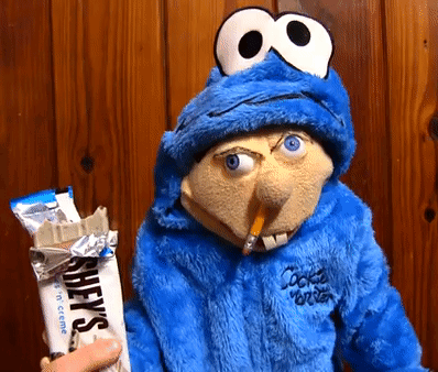 Cookie Monster Puppet Holding Hershey's Chocolate Bar