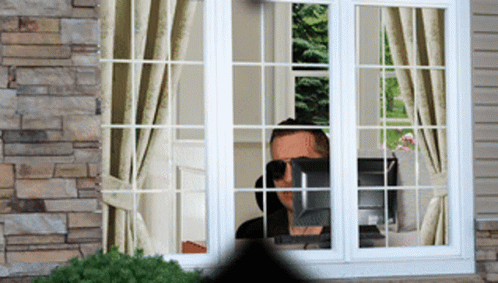 Cool Man Looking Out The Window GIF