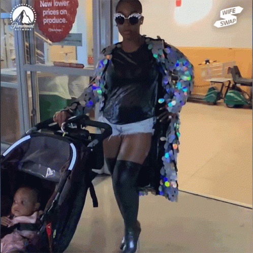 Cool Mom Wearing Shades And Heeled Boots GIF