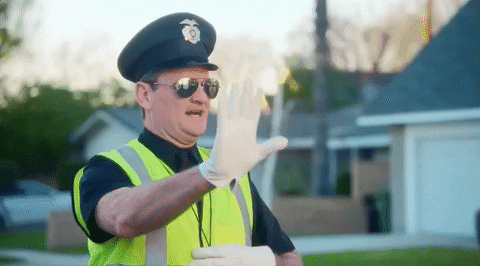 Traffic Cop Brett Eldredge Directing Traffic GIF