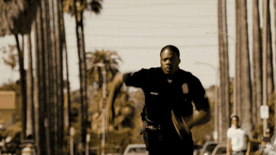 Cop Chasing Criminal Snow Fall GIF