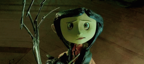 Coraline From Coraline The Animated Movie Is Holding A Cat GIF